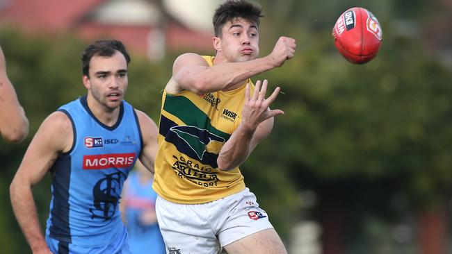 Eagle Riley Knight dishes out one of his 26 handballs in his team's convincing 49-point win against Surt. Picture: Dean Martin.