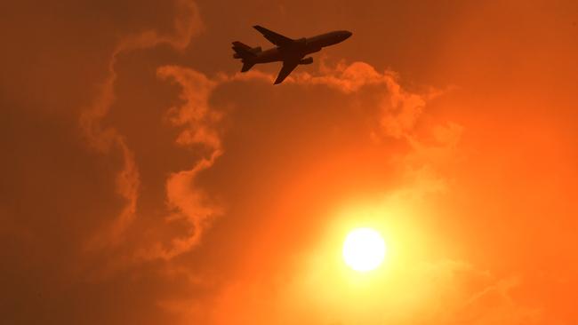 A DC-10 Air Tanker makes a pass to drop fire retardant on a bushfire at North Nowra, NSW. Picture: AAP