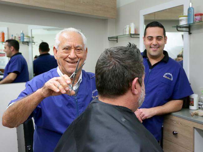 Frank Tedesco is 84 and celebrates 50 years in business at Crows Nest next month. Pictured hard at work with son Michael who is not so hard at work. Picture: Adam Ward