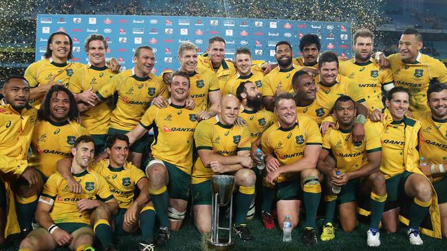 The Wallabies celebrate after wining the Rugby Championship trophy after the Wallabies v New Zealand All Blacks Bledisloe Cup match at ANZ Stadium, Sydney. Picture: Brett Costello