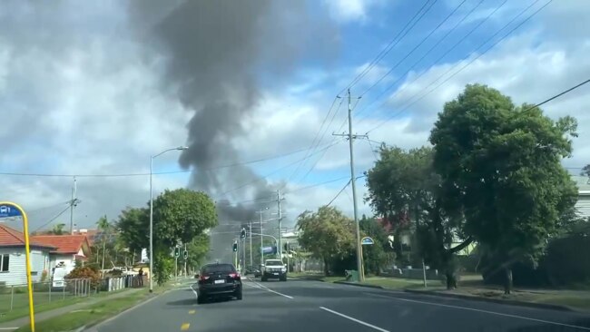 A plume of black smoke billows from the Hamilton house fire.