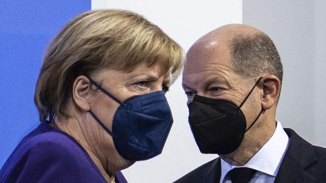 German Chancellor Angela Merkel and her successor Olaf Scholz announce lockdown for anyone refusing to take the Covid injection: Picture: AFP.