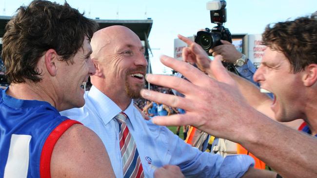 Roy Laird and the Gowans brothers celebrate the 2009 grand final victory.