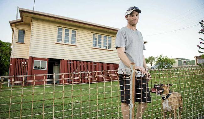 Tyson Lowe and his dog Campbell have lived in Rob Lovell’s Barney Point home for more than two years. His lease ran out in November and he thought it was odd when he didn’t hear from the real estate agent. He thought it was because he was a good tenant; when in fact the agent had gone bankrupt and the home owner hadn’t been contacted. Picture: Paul Braven GLACENTURY