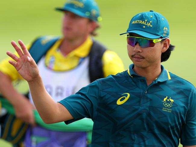 PARIS, FRANCE - AUGUST 02: Min Woo Lee of Team Australia acknowledges the crowd on the 18th green during Day Two of the Men's Individual Stroke Play on day seven of the Olympic Games Paris 2024 at Le Golf National on August 02, 2024 in Paris, France. (Photo by Andrew Redington/Getty Images)