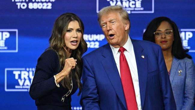 Donald Trump speaks with moderator and South Dakota Governor Kristi Noem during a town hall in Oaks, Pennsylvania, on October 14. Picture: AFP