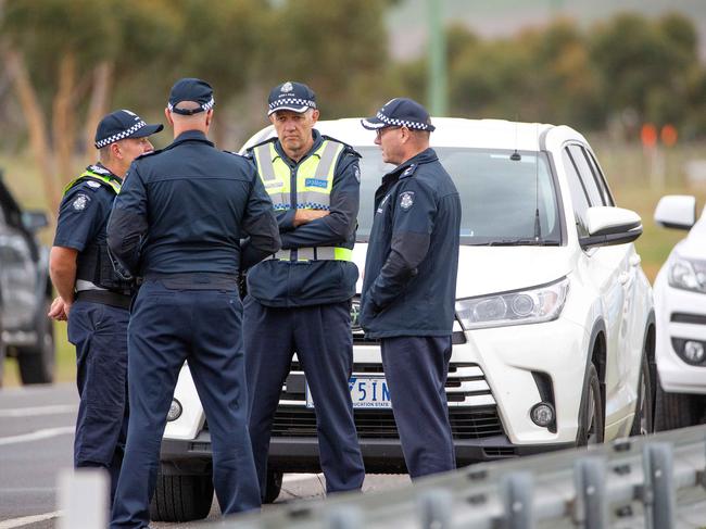 Police and media watch on as George Pell leaves Barwon Prison in Anakie, Victoria, after the High Court quashed his conviction. Picture: Mark Stewart