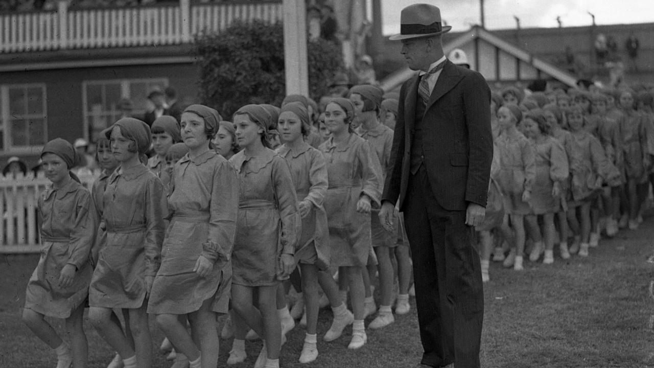 Watch your step, ladies. Schoolgirls coming on to the main arena in 1937.