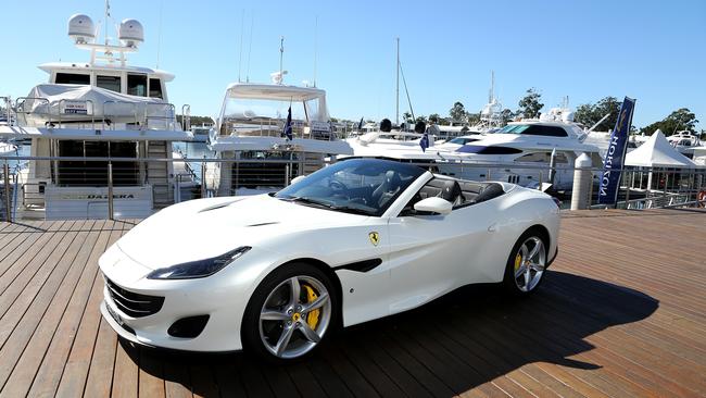 Italian luxury car marques Ferrari (pictured) and Maserati have pulled into the Gold Coast to capitalise on a new wave of wealthy residents.