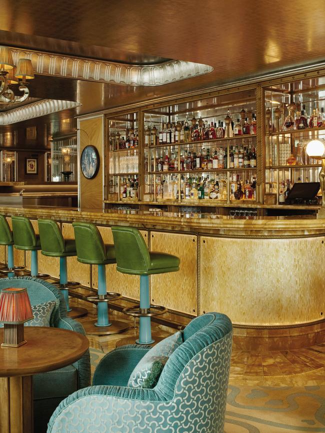 Vesper Bar in London, with mirrored accent walls, Palladium-leaf ceiling, and Art Deco-style furniture.