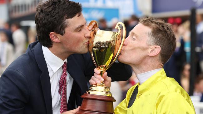 Sam Freedman and jockey Mark Zahra kiss the Caulfield Cup. Picture: Michael Klein