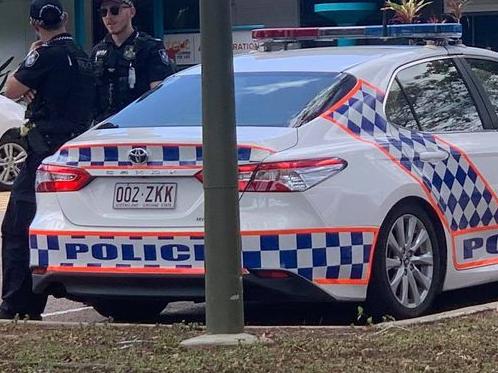 Police at the Townsville school where a teacher and a girl were stabbed.