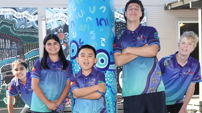 Pacific Hope Christian School students at Tweed Heads wearing a new school shirt which has an indigenous design. Left to right: Djinda Simms-Roberts 9, Ayshah Nixon 11, Marcom Berador 8, William Sanderson 16, and Ashton Draper 16 wearing the new uniform. Picture Glenn Hampson