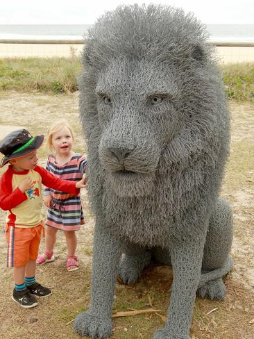 Swell Sculpture Festival: L-R Kurtis Beesley, 3, and Ellie Swift of Coolangatta looking at the lion. Pict:ure: Mike Batterham