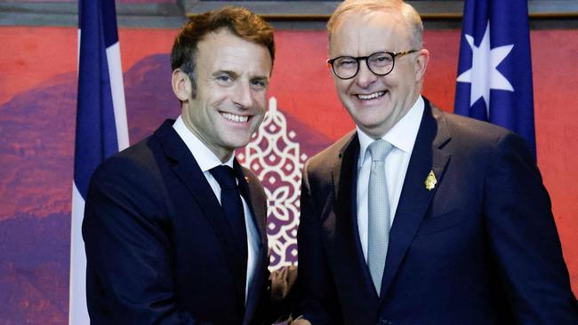France's President Emmanuel Macron (L) meets Australia's Prime Minister Anthony Albanese on the sidelines of the G20 Summit in Nusa Dua on the Indonesian resort island of Bali on November 16, 2022. (Photo by Ludovic MARIN / POOL / AFP)