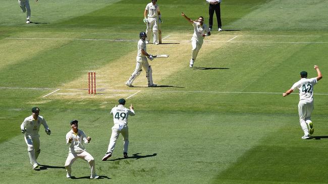 Scott Boland celebrates after dismissing Joe Root of England to a catch by David Warner at first slip Picture: Getty Images