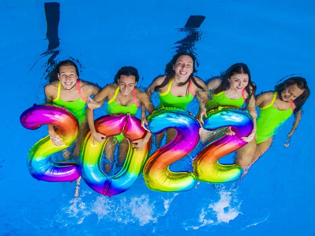 Gold Coast Mermaids Synchronised Swimming Club members Milena Waldmann, 17, Zoe Poulis, 15, Georgia Courage-Gardiner, 18, Cliodhna Ni Cathain, 16, and Evie Caple, 14 celebrate New Years Eve and welcome a bright outlook for 2022 at the Gold Coast Aquatic Centre.Picture: NIGEL HALLETT