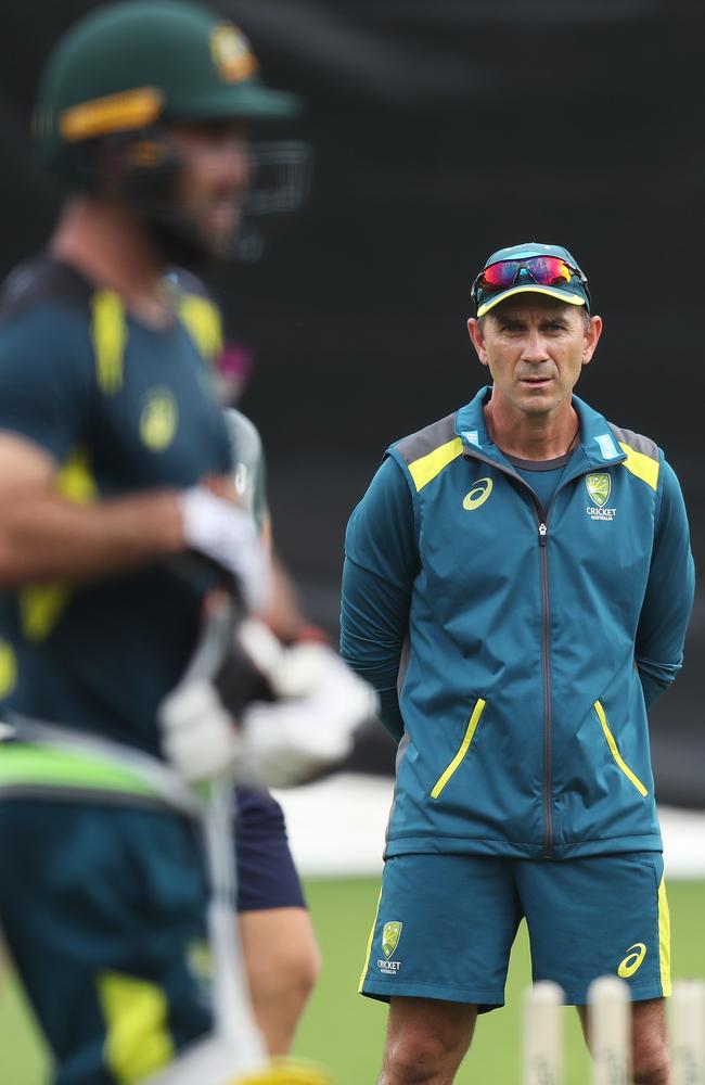 Justin Langer watches Glenn Maxwell bat during an Australian training session in 2019. Polar-opposite characters, there was friction between the pair. Picture: Brett Costello