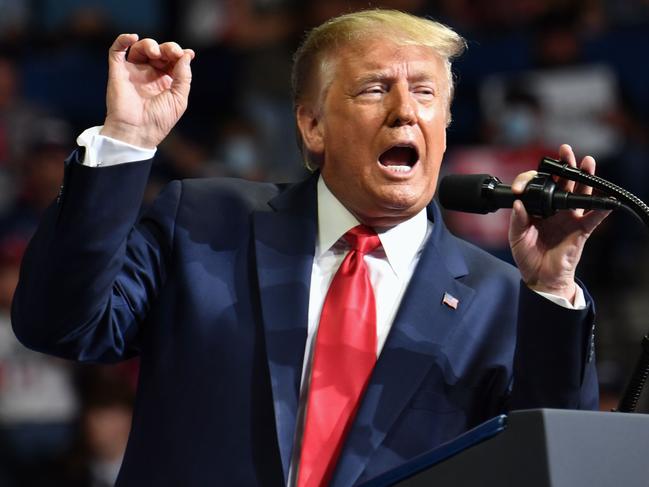 TOPSHOT - US President Donald Trump speaks during a campaign rally at the BOK Center on June 20, 2020 in Tulsa, Oklahoma. - Hundreds of supporters lined up early for Donald Trump's first political rally in months, saying the risk of contracting COVID-19 in a big, packed arena would not keep them from hearing the president's campaign message. (Photo by Nicholas Kamm / AFP)