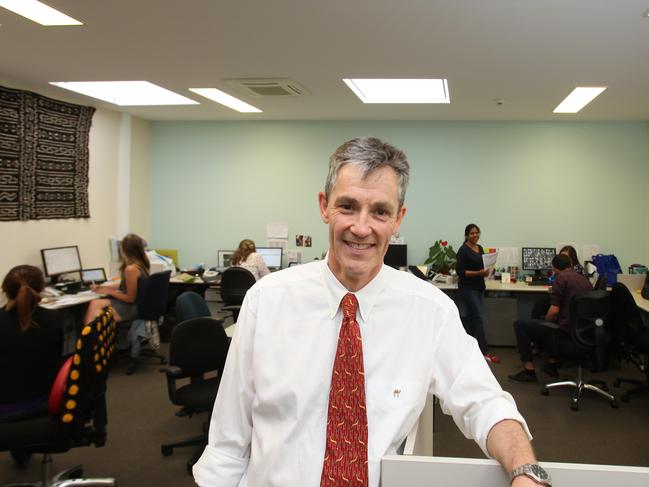 REFUGEE WELCOME - CatholicCare Multicultural Service Programs Manager, James Norman is pictured at his office in New Town. He is speaking with the media, and is also pictured with other support workers in the background. PIC: MATT THOMPSON