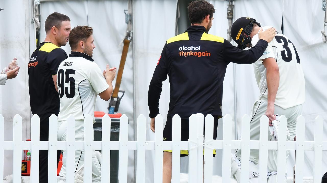 Green is congratulated by his teammates after his epic knock.