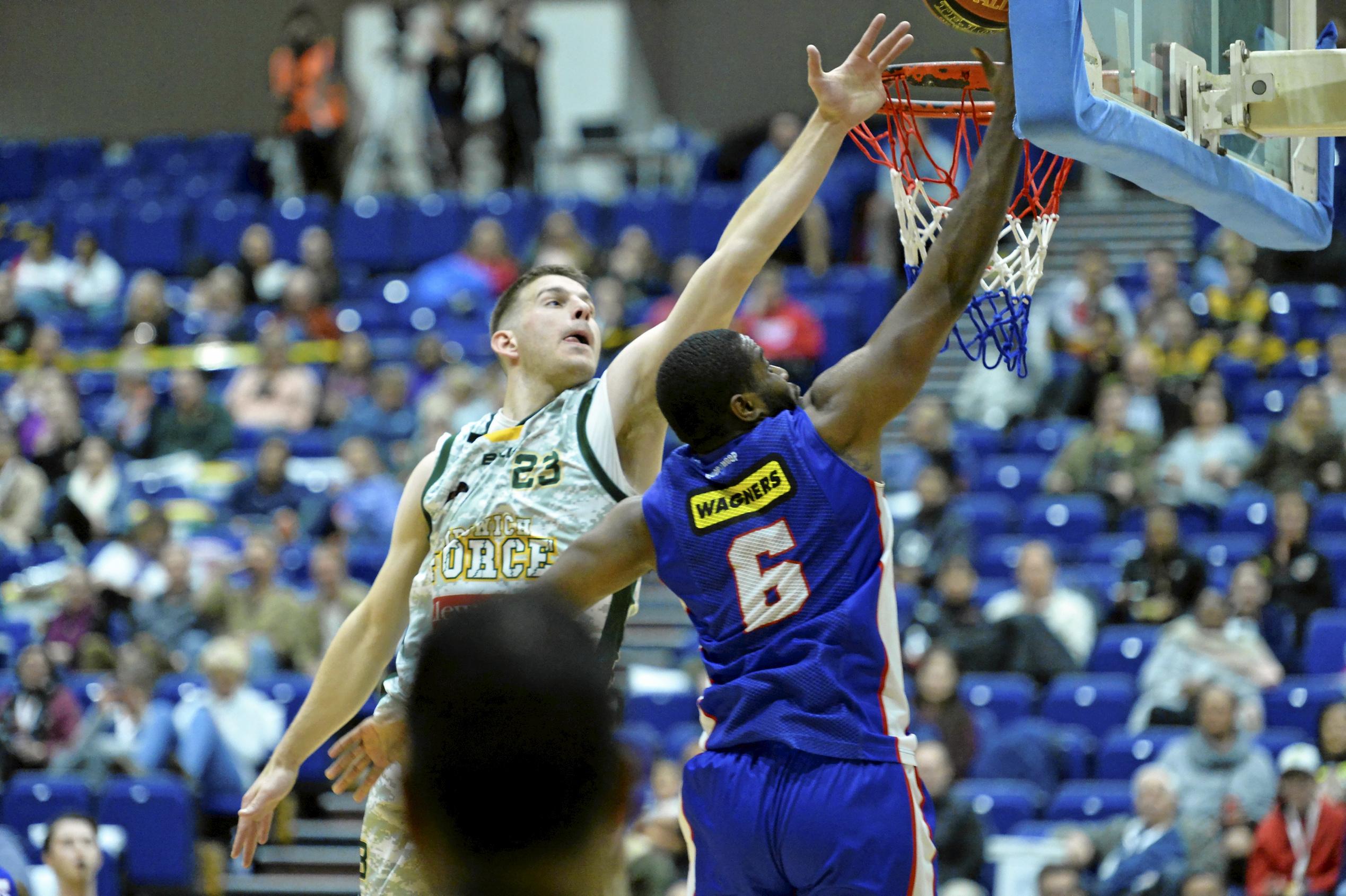 Kyle Harvey (left) of Ipswich Force and Damon Bozeman for Toowoomba Mountaineers under the Mountaineers basket in QBL men round seven basketball at USQ's Clive Berghofer Recreation Centre, Saturday, June 9, 2018. Picture: Kevin Farmer