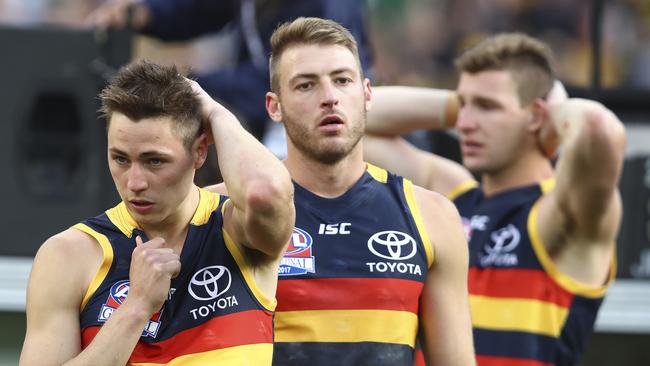 Jake Kelly, Daniel Talia and Josh Jenkins after last year’s grand final loss. Picture Sarah Reed