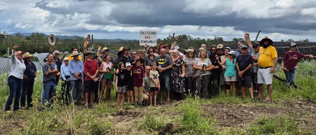 Protesters gather at the Bullyard property of Michelle Hunt (on left, below right), near Gin Gin in Queensland, to help remove part of the 1.8m-high boundary fence erected without permission by a solar farm developer