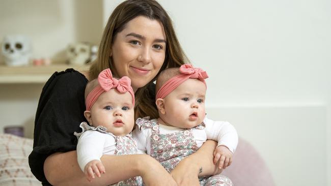 Taylor Whitcombe with twin daughters Delilah and Noah Whitcombe, now aged six months at their Elizabeth Park home. Picture: Mark Brake