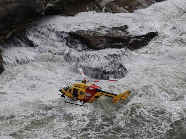 The Westpac helicopter searches for a person missing in the ocean off Bondi. Picture: Toby Zerna