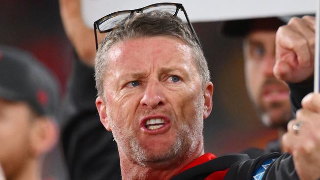 MELBOURNE, AUSTRALIA - JULY 06: Damien Hardwick, Senior Coach of the Suns speaks to players during the round 17 AFL match between North Melbourne Kangaroos and Gold Coast Suns at Marvel Stadium, on July 06, 2024, in Melbourne, Australia. (Photo by Morgan Hancock/AFL Photos/via Getty Images)