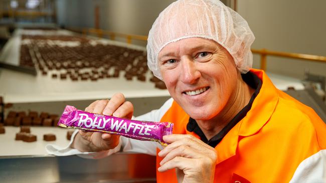 Robert Menz CEO Phil Sims with a Polly Waffle bar at the Glynde factory. Picture: Matt Turner