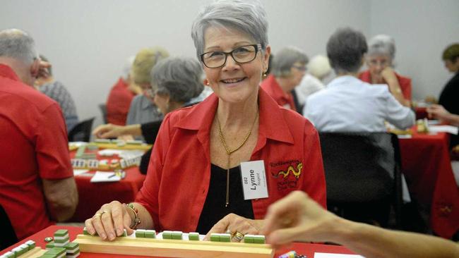 TILES STYLE: Lyn Nugent (name badge incorrectly spelled) at Rockhampton Mahjong challenge. Picture: Jann Houley