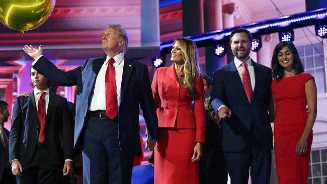 Republican presidential candidate Donald Trump, former First Lady Melania Trump, Trump’s VP pick J.D. Vance and his wife Usha Vance on stage at the RNC.