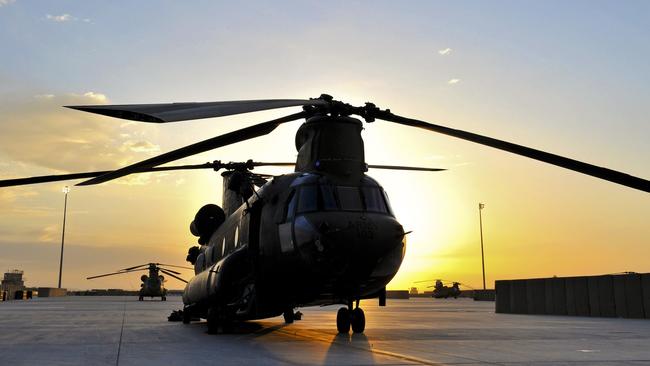 An Australian Rotary Wing Group Chinook being prepared for an early morning mission at Kandahar Airfield. Picture: Corporal Mark Doran