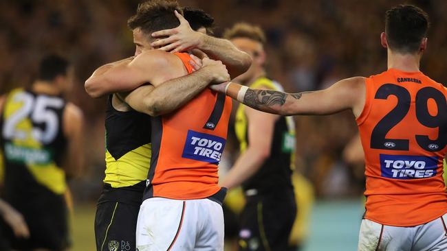 Trent Cotchin consoles former teammate Brett Deledio after the preliminary final. Picture: Phil Hillyard