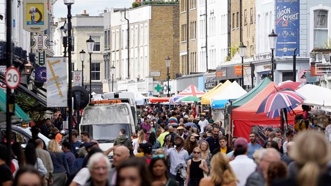 Shoppers browse at Portobello Road market in Notting Hill, west London, as the UK enjoys their new-found freedom, after the government relaxed virus curbs. Picture: AFP