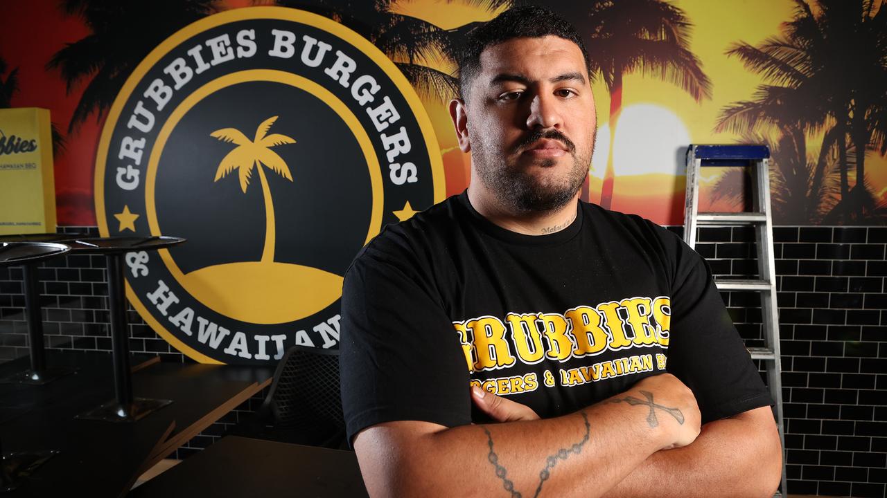 Owner of Grubbies, Ben Niumata, in his burnt and damaged Strathpine store. Picture: Liam Kidston