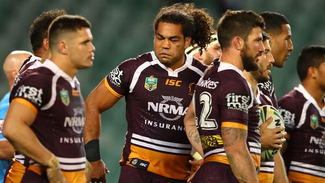 Broncos players watch on after a Roosters try at Allianz Stadium.