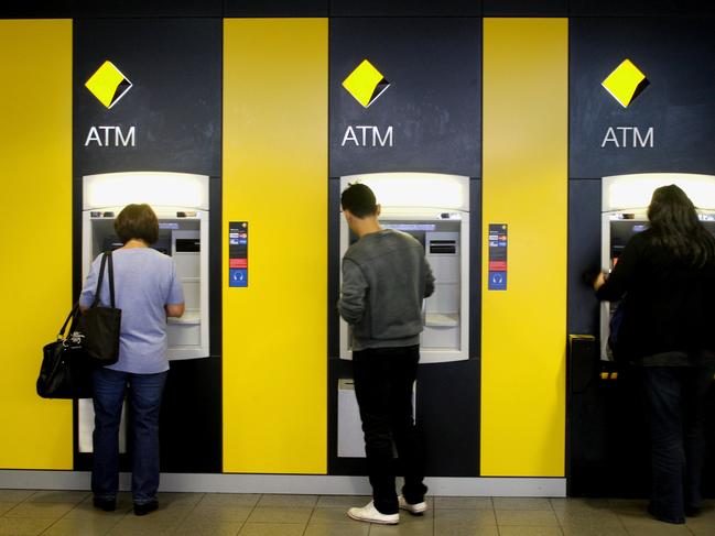 Customers use a Commonwealth Bank of Australia Ltd. (CBA) automatic teller machine in Sydney on Friday, April 8, 2011. The Australian dollar hit a new post-float high of 105.08 US cents, after the Australian March unemployment rate fell to 4.9 percent. (AAP Image/Sergio Dionisio) NO ARCHIVING