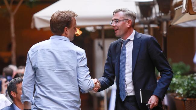 Dominic Perrottet and a well wisher as he leaves lunch at Brasserie Felix. Picture: Justin Lloyd