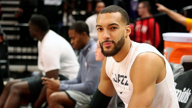 In this file photo taken on December 04, 2019 Utah Jazz center Rudy Gobert cools down after warm ups before a NBA game against Los Angeles Lakers in Salt Lake City, Utah. - Utah Jazz star Rudy Gobert, who apologized for his careless actions before he was diagnosed with novel coronavirus, has pledged to donate more than half a million dollars to health services and arena workers affected by the pandemic. More than half the money will go towards COVID-19 related social service programs in Utah, Oklahoma City and the French health care system, the NBA's Jazz said in a statement on March 14, 2020. (Photo by GEORGE FREY / AFP)