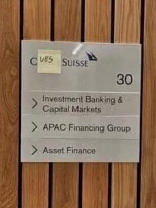 A sticky-note on the Credit Suisse shingle.