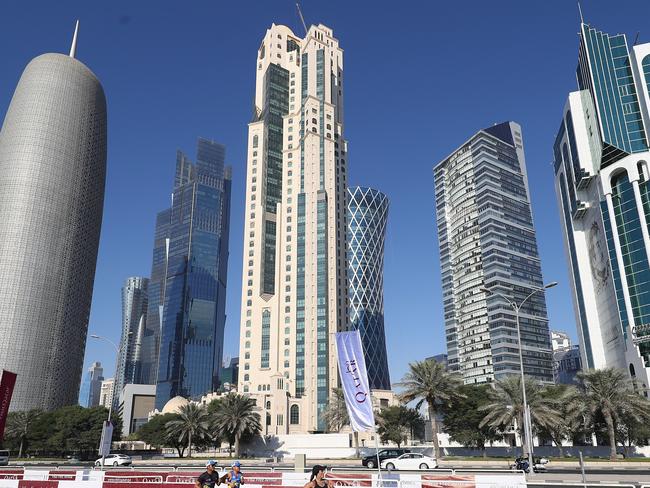 DOHA, QATAR - JANUARY 12:  General view as athletes pass the downtown skycrapers on Al Corniche. The Ooredoo Doha Marathon is Qatar's largest mass-participation sports event with 2,400 athletes representing 83 countries. The sixth edition included elite athletes competing for prize money of $50,000 in half marathon distance on a 10km loop route along La Corniche on January 12, 2018 in Doha, Qatar.  (Photo by Michael Steele/Getty Images for QTA)