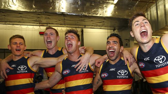 David McKay, Tom Lynch, Riley Knight, Eddie Betts and Jake Kelly sing the club song after Adelaide’s preliminary final defeat of Geelong at Adelaide Oval. Picture Sarah Reed