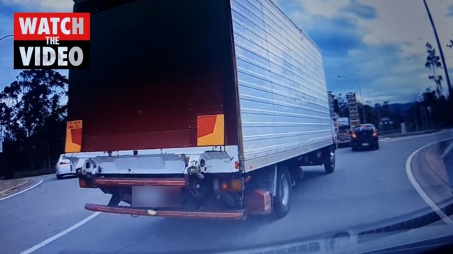 Truck reverses towards car at Exit 49 roundabout