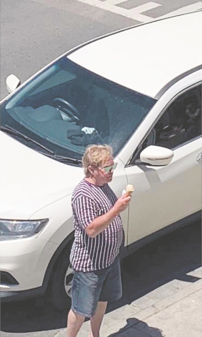 Sir Elton John enjoying an ice-cream outside a cafe near Geelong.