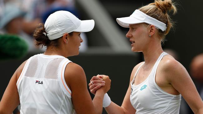 Australia’s Ash Barty (left) and her Wimbledon conqueror Alison Riske shake hands after their fourth round women’s singles match. Picture: AFP