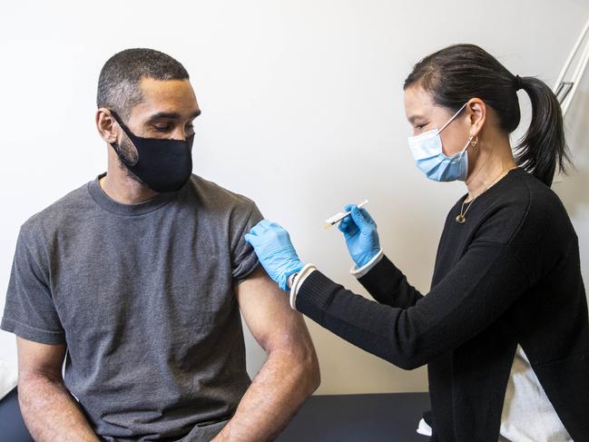 21/07/2021 Dr. Adrienne Chan administers Callum Silcock's (37) AstraZeneca vaccination. Aaron Francis/The Australian