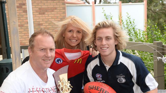 Northern Knights midfielder Darcy MacPherson at home with parents Steve and Karen Macpherson and some Darcy’s football memorabilia